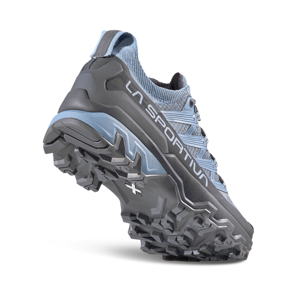 grey and blue hiking shoe on a white background